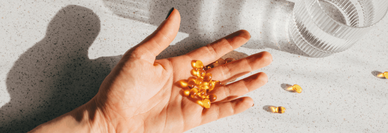Image of photo of vitamin D capsules on a hand