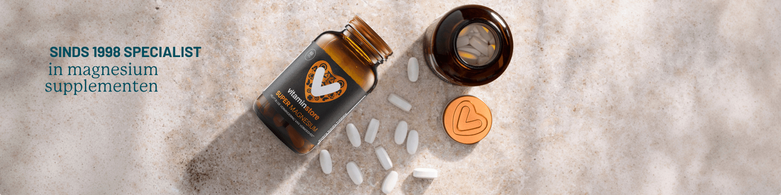 foto van een pot magnesium met losse pillen ernaast